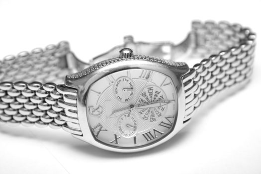 Silver man's watch. Isolation on a white background. Macro. Shallow DOF