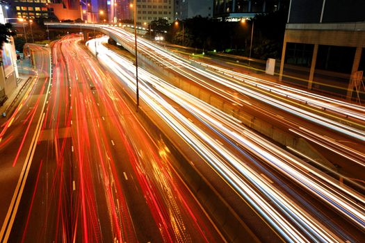 Blurs of night city traffic streams