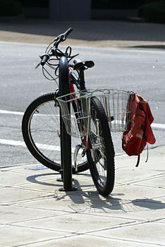 Bicycle parked in the city and locked.               