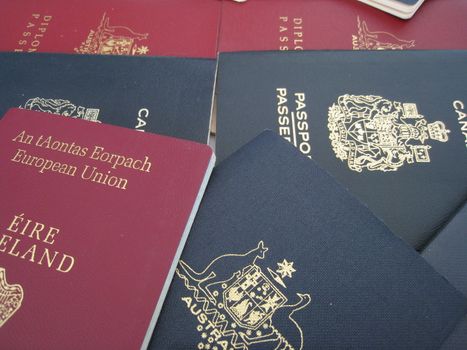a selection of passports from Australia, Canada and Ireland