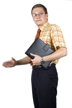 Young, elegant European businessman, wearing suit, shirt and tie. Smiling friendly. Holding notebook, ready to shake hands with business partner