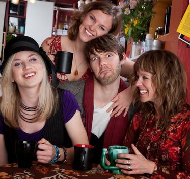 Four friends enjoying time together at a cafe