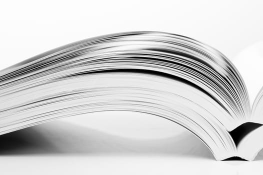 open books on white table
