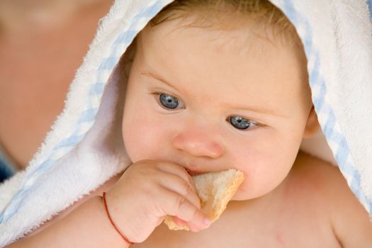 people series: portrait of adorable baby with bread