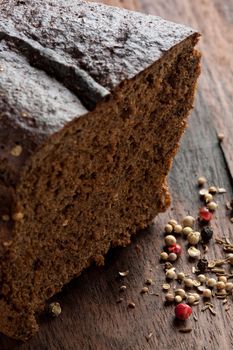 Cantle and slice of dark rye bread or cake
