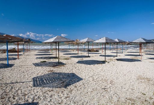 Set of beach umbrellas on sand 