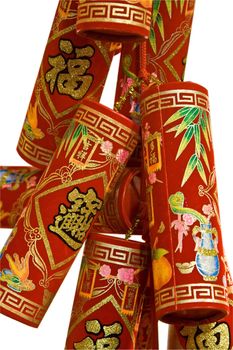 Red Chinese fire crackers that are used for celebration of the Lunar New Year, isolated on white