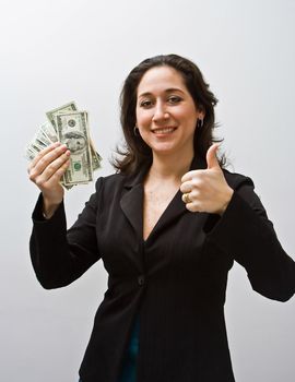 Business women thumbs up and holding money isolated on a white background