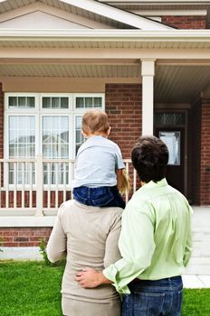 Young happy family shopping for new home