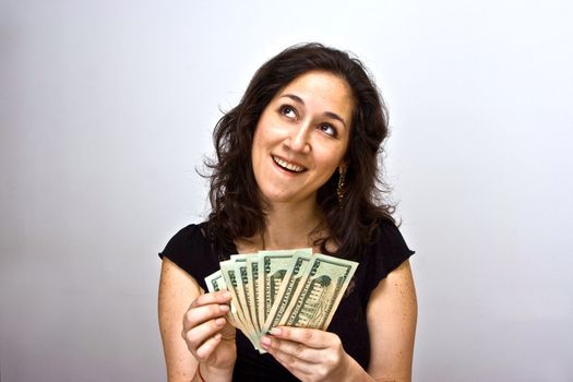 Women counting money and thinking what she can do with it