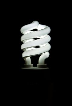 A glowing fluorescend light bulb that is environmently friendly and saves money.