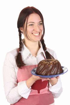 beautiful housewife showing off bundt cake on white background