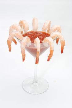 Shrimp cocktail in martini glass.