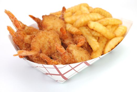 Fried shrimp and french fries basket isolated on white background.
