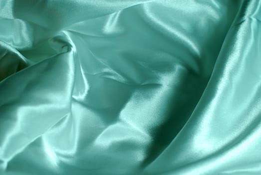 Blue tint satin fabric for background use.