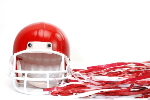 Red football helmet and pom poms isolated on white background.