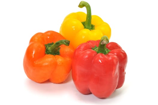 Three colorful bell peppers isolated on white background.l