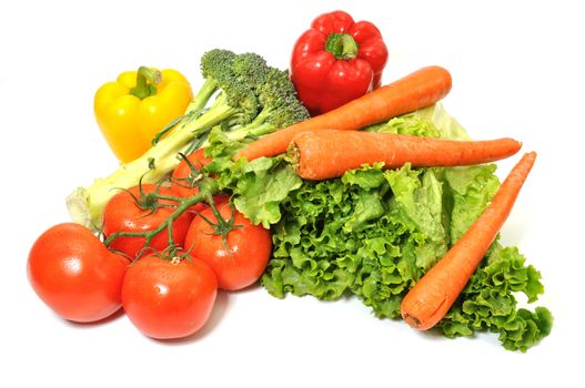 Green leafy lettuce, tomatoes, carrots, and bell peppers isolated on white background.l