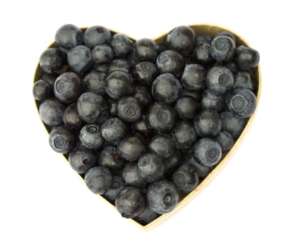 Bilberries (eruopean blueberries) in heart shaped box, isolated on white background