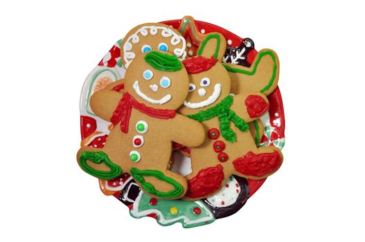 Plate of decorated gingerbread cookies isolated on white background with clipping path.