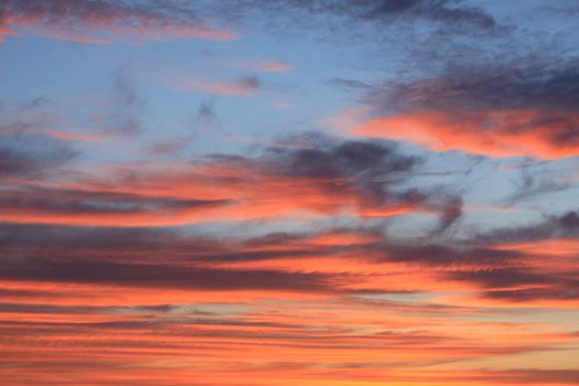 Orange clouds on evening sky.