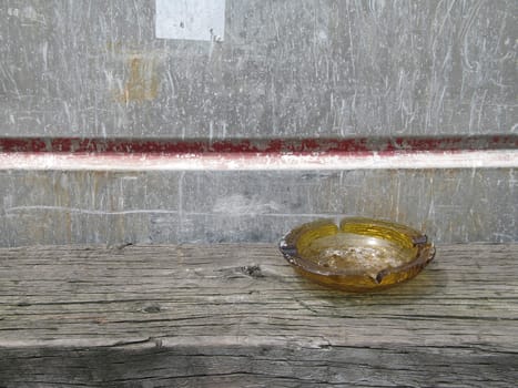 brown ashtray on a bench