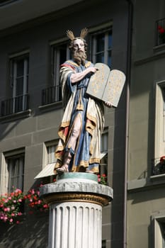 Sculpture at Munsterplatz in Bern, Switzerland. Moses holding the Ten Commandments.