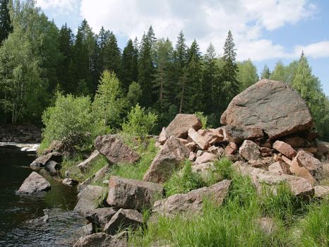 Boulders on a river bank in Karelia, Russia
