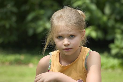 Portrait of girls in the open air on the blur background 