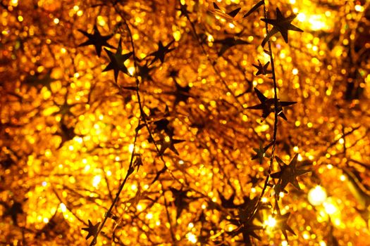 Illuminated golden Christmas tinsel background