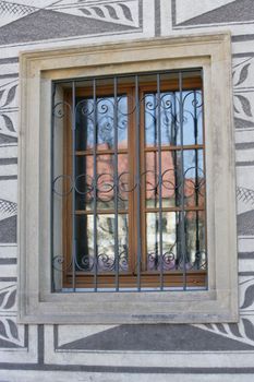 Shot displays home in the reflection of a window near Prague Castle in the Czech Republic