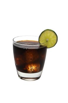 Rum and cola with lime slice isolated on white background with clipping path.
