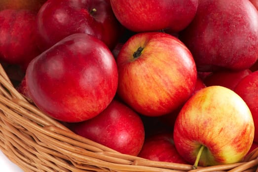 Harvesting. A basket with red ripe apples.