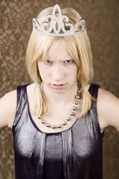 Angry teenage girl wearing a tiara