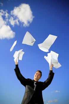 Young man throws away his documents.