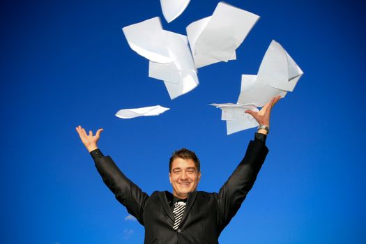 Young man throws away his documents.