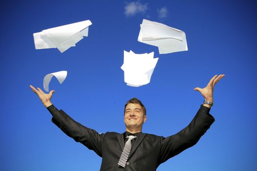 Young man throws away his documents.