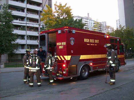 firemen and fire truck at scene of fire