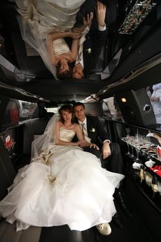 Newly-married couple in car