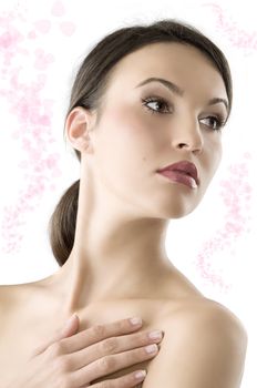 portrait of a young and beautiful brunette with natural makeup looking over