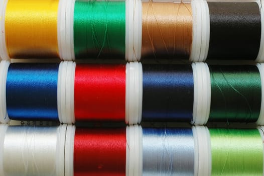 Sewing thread in assorted colors.