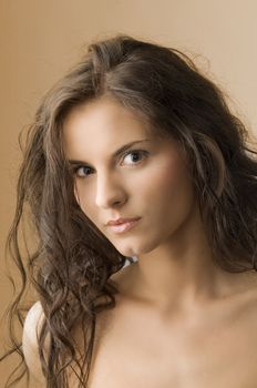 nice portrait of a cute brunette with moved hair and and brown eyes