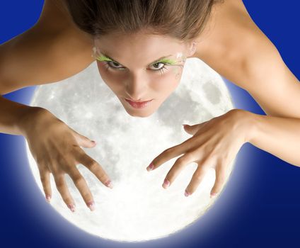 girl flying as in a dream trying to get with her hands the moon