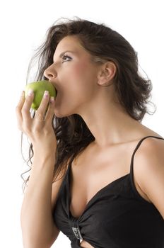 pretty and sensual brunette biting a green apple