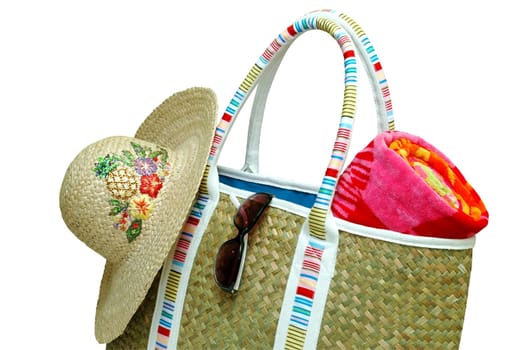 Beach bag with beach towel, sun hat, and sunglasses.  Isolated with clipping path. 