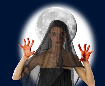 woman with black veil and bloody hand with a big moon in background