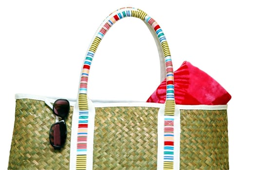 Beach bag with beach towel and sunglasses.  Isolated with clipping path.