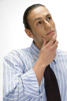 young guy thinking something and looking upwards