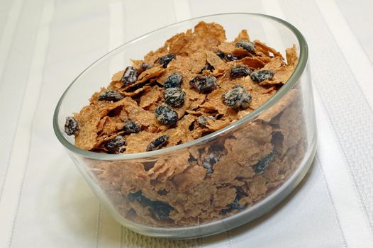 Bowl of raisin bran on kitchen table.