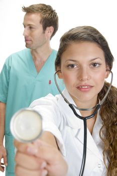 close up of smiling lady doctor with stethoscope and male doctor